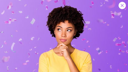 Person thinking about adding popups to their website with confetti in the background.